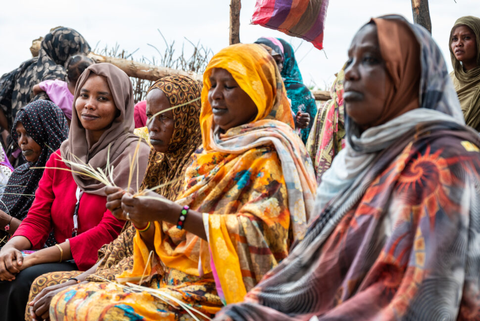 Women sitting together in a meeting.