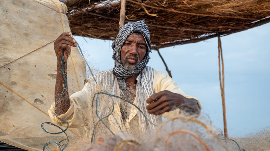 Fisher arrange his net.